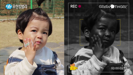 유한킴벌리 그린핑거가 진행하고 있는 ‘썬 캠 출동’ 캠페인의 한 장면. 아이의 얼굴과 손 전체가 까맣게 보여 자외선 차단이 제대로 이뤄지고 있음을 확인할 수 있다. /사진제공=유한킴벌리