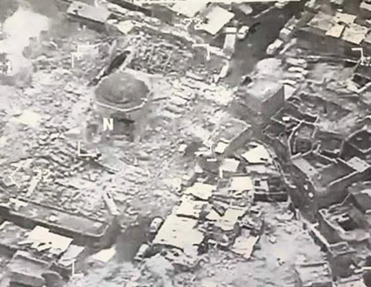 epa06042179 A handout aerial image made available by the Combined Joint Task Force (CJTF) shows the destroyed remains of the Great Mosque of al-Nuri in Western Mosul, Iraq, 21 June 2017. According to the CJTF Operation Inherent Resolve press release, the mosque was destroyed by ISIS as Iraq Security Forces closed in. Also according to the release, ‘the mosque had stood for over eight centuries and its famous leaning minaret had earned the city of Mosul the nickname The Hunchback.’  EPA/COMBINE