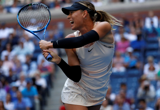 Tennis - US Open - New York, U.S. - August 30, 2017 - Maria Sharapova of Russia in action against Timea Babos of Hungary in their second round match. REUTERS/Mike Segar      <저작권자(c) 연합뉴스, 무단 전재-재배포 금지>