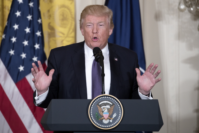 <YONHAP PHOTO-1394> epa05905201 US President Donald J. Trump responds to a question from the news media during a joint press conference with  NATO Secretary General Jens Stoltenberg in the East Room of the White House in Washington, DC, USA, 12 April 2017. The White House says the President will use the meeting as an opportunity to reaffirm his commitment to NATO.  EPA/SHAWN THEW/2017-04-13 06:22:43/<저작권자 ⓒ 1980-2017 ㈜연합뉴스. 무단 전재 재배포 금지.>
