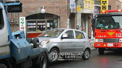 부산지역서 사고차량 견인 이권을 독점하기 위해 조폭을 동원해 폭력을 휘두른 일당이 붙잡혔다./연합뉴스[사진과 기사 내용은 직접적 관련 없음]