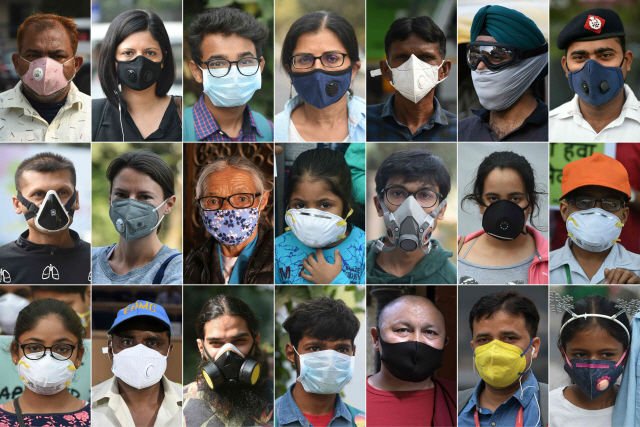 6일(현지시간) 인도의 수도 뉴델리에서 극심한 스모그를 피해 마스크를 쓰고 있는 사람들의 모습/AFP연합뉴스