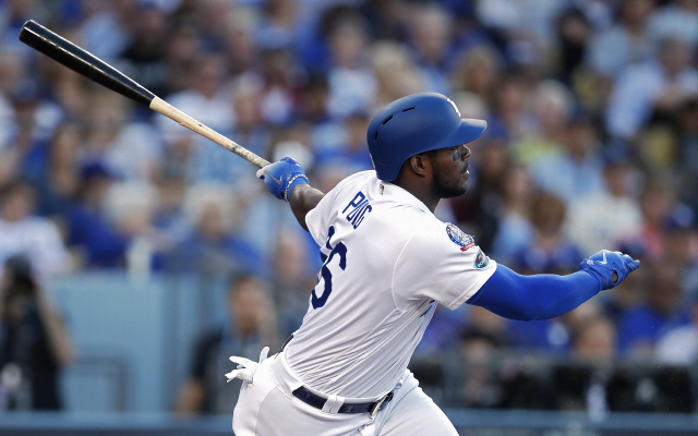 epa07241147 (FILE) - Los Angeles Dodgers right fielder Yasiel Puig of Cuba hits a double in the second inning of the MLB National League Championship Series baseball game three between the Milwaukee Brewers and the Los Angeles Dodgers at Dodger Stadium in Los Angeles, California, USA, 15 October 2018 (reissued 20 December 2018). The United States Major League Baseball (MBL) and the Baseball Federation of Cuba have reached an agreement to allow Cuban players to sign MBL contracts without having to defect from Cuba.  EPA/MIKE NELSON      <저작권자(c) 연합뉴스, 무단 전재-재배포 금지>