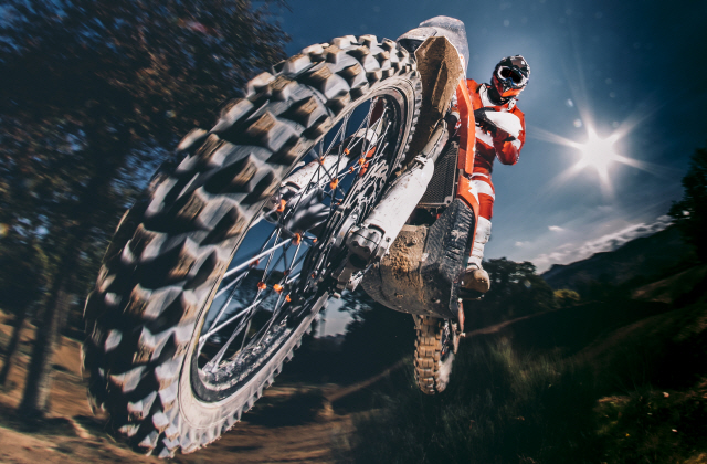 Motocross biker jumping