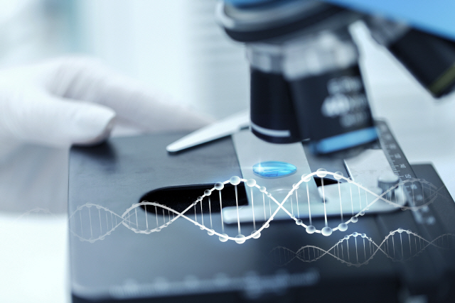 science, chemistry, biology, medicine and people concept - close up of scientist hand with test sample making research in clinical laboratory with dna molecule structure