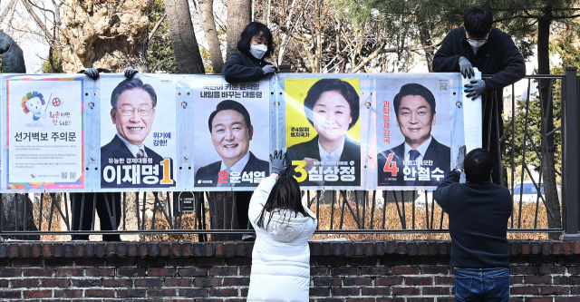 은평구서 '이재명 벽보' 훼손한 빨간 패딩 50대 체포…'술 취해서'