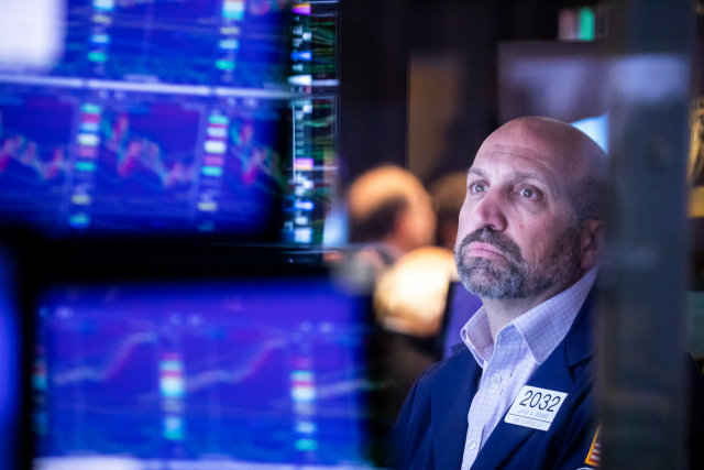 (220506) -- NEW YORK, May 6, 2022 (Xinhua) -- A trader works on the floor of the New York Stock Exchange (NYSE) in New York, the United States, May 5, 2022. U.S. stocks plunged on Thursday as heavy selling intensified on Wall Street. The Dow Jones Industrial Average tumbled 1063.09 points, or 3.12 percent, to 32,997.97. The S&P 500 fell 153.30 points, or 3.56 percent, to 4,146.87. The Nasdaq Composite Index shed 647.17 points, or 4.99 percent, to 12,317.69. (Photo by Michael Nagle/Xinhua)