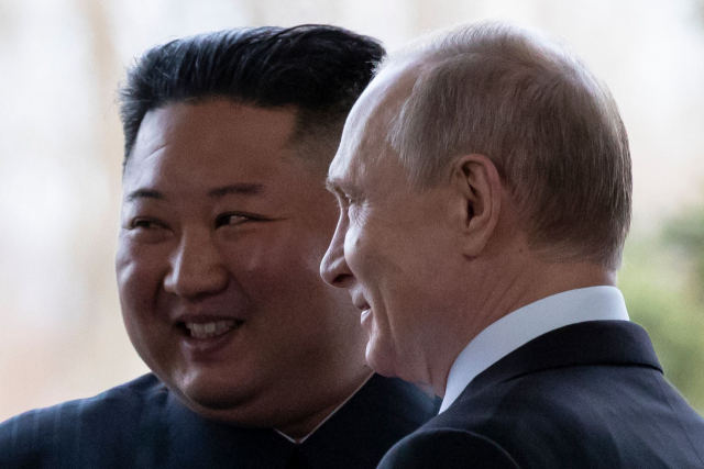 (FILES) Russian President Vladimir Putin welcomes North Korean leader Kim Jong Un prior to their talks at the Far Eastern Federal University campus on Russky island in the far-eastern Russian port of Vladivostok on April 25, 2019. North Korea\'s leader Kim Jong Un departed Pyongyang on September 12, 2023 on a train to Russia where he is due to hold a rare meeting with President Vladimir Putin, state media reported early September 12, 2023. (Photo by Alexander Zemlianichenko / POOL / AFP)