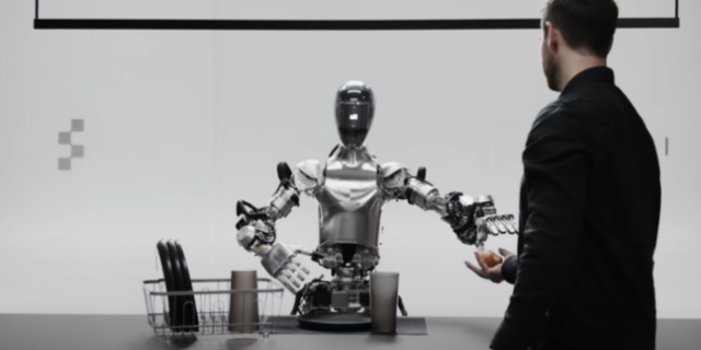 피겨 AI의 휴머노이드 로봇 ‘피겨 01’이 사람에게 사과를 건네고 있다. 피겨 유튜브 캡쳐