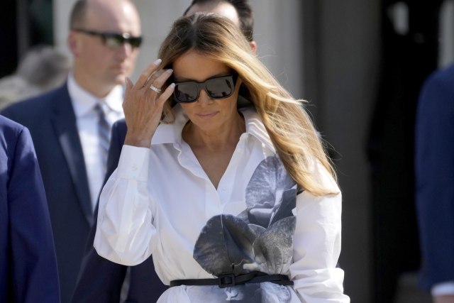 FILE - Former first lady Melania Trump leaves after voting in the Florida primary election in Palm Beach, Fla., March 19, 2024. Melania Trump is not expected to speak at next week’s Republican National Convention, which will feature speeches by other Trump family members and a long list of GOP officials. The former first lady will attend the convention, but does not appear on a list of headliners and keynote speakers released by convention organizers Saturday, July 13. (AP Photo/Wilfredo Lee, File) FILE PHOTO