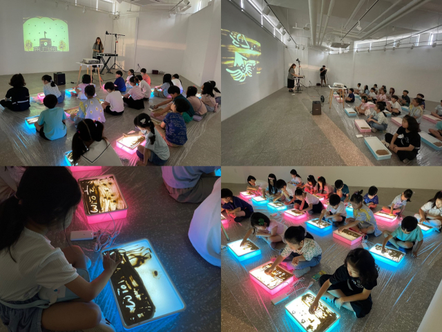 반도문화재단이 개최한 샌드아트 체험프로그램에 참여한 아이들의 모습. 사진 제공=반도건설